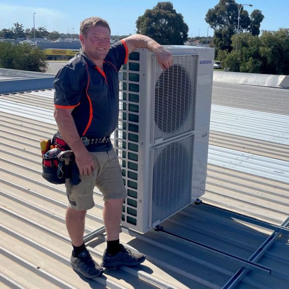 on the roof after servicing and repairing an air conditioner